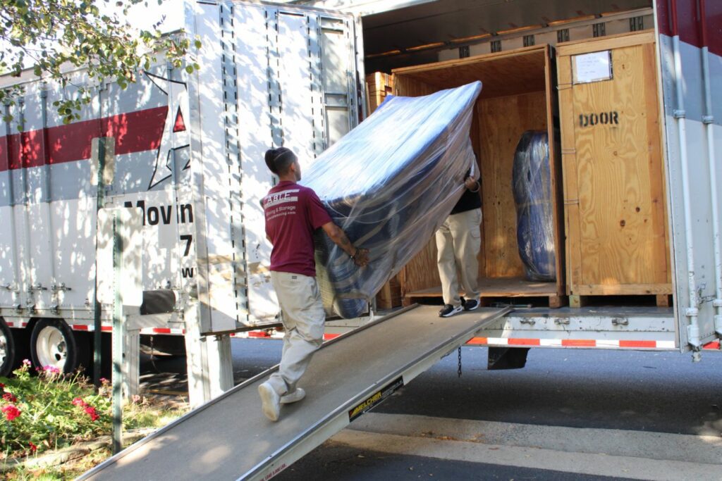 Able Moving Employees moving furniture into a truck